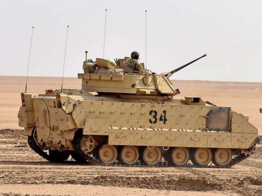 PHOTO: U.S. soldiers load M2A2 Bradley Fighting Vehicles headed to Deir ez Zor, Syria as part of a new U.S. troop deployment to defend the oil fields in that region.
