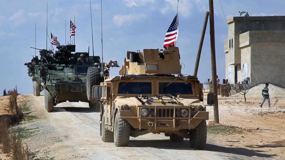 This Tuesday, March 7, 2017 frame grab from video provided by Arab 24 network, shows U.S. forces patrol in al-Asaliyah village, Aleppo province, Syria.
