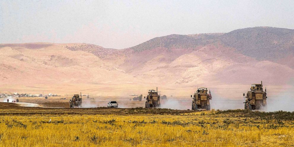 PHOTO: US Oshkosh M-ATV Mine Resistant Ambush Protected (MRAP) military vehicles drive during a patrol near the Syrian-Turkish border in one of the villages that was bombarded the previous week in Syria's northeastern Hasakah province, on Aug. 21, 2022.  