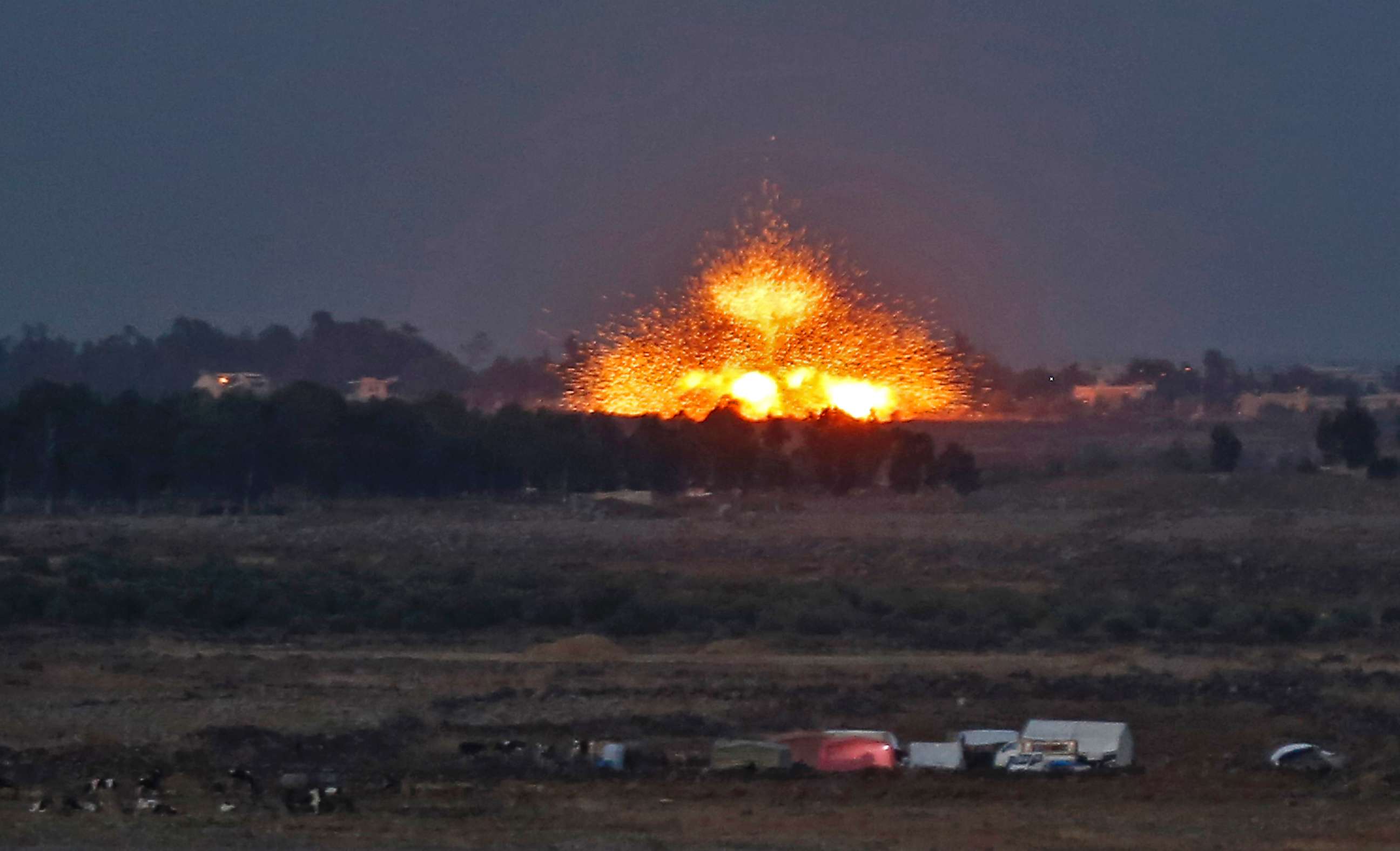 PHOTO: An explosion caused by aerial bombardment across the border in Syria, during air strikes backing a Syrian-government-led offensive in the southwestern province of Daraa, July 23, 2018.