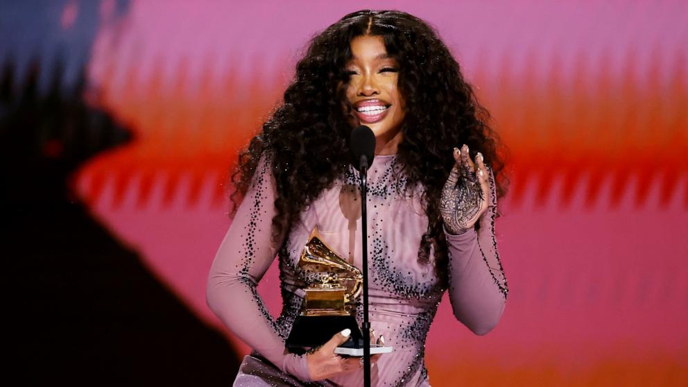 PHOTO: SZA accepts the Best R&B Song award for "Snooze" during the 66th GRAMMY Awards, Feb. 4, 2024, in Los Angeles.