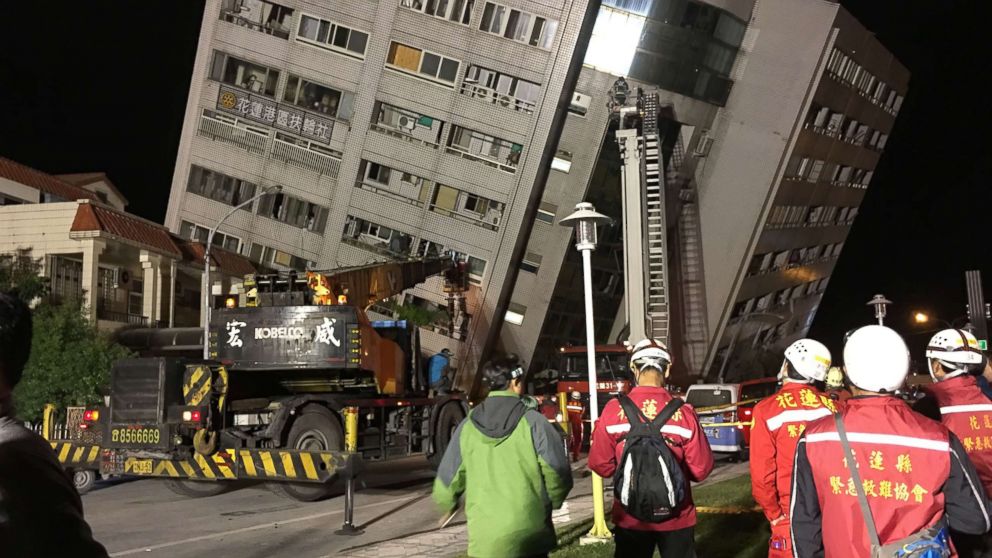 PHOTO: A damaged building is surrounded by first responders in Hualien, eastern Taiwan, after an earthquake hit Hualien on the night of Feb. 6, 2018.