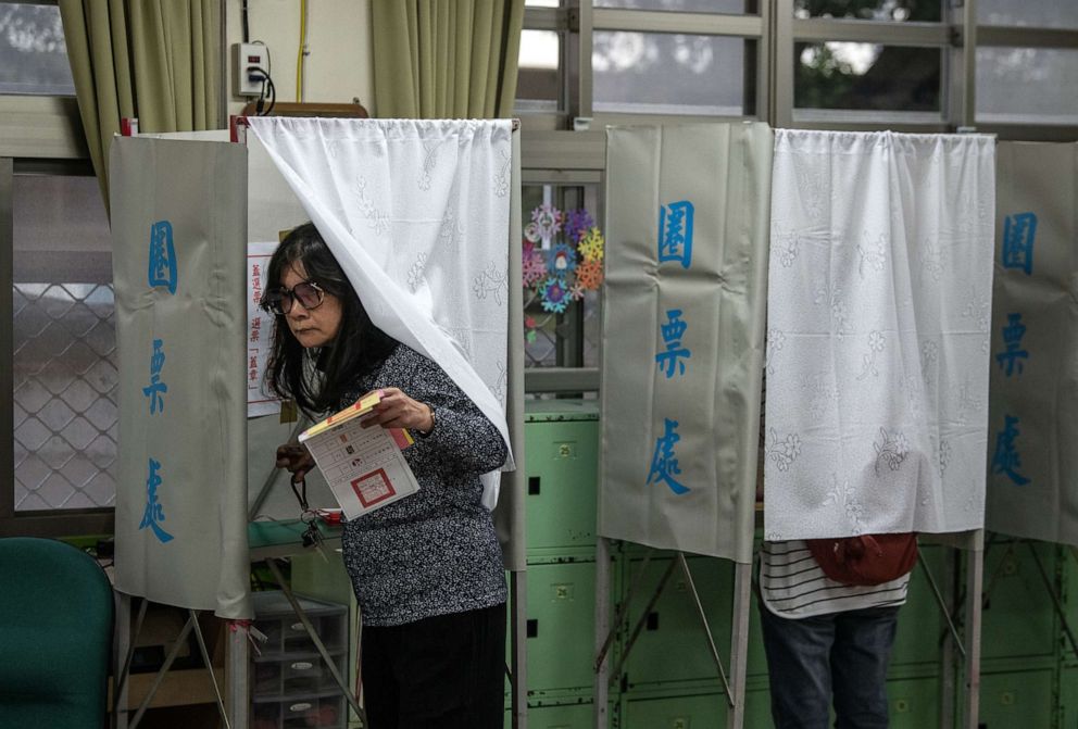 PHOTO: A woman exits a polling booth as she casts her vote in the presidential election on Jan. 11, 2020 in Taipei, Taiwan.