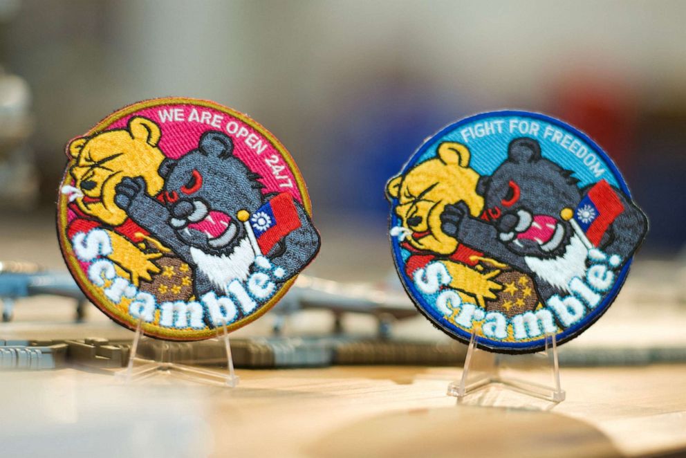 PHOTO: This picture shows patches depicting a Formosan black bear holding a Taiwanese flag punching Winnie-the-Pooh at a shop in Taoyuan, Taiwan, on April 11, 2023.