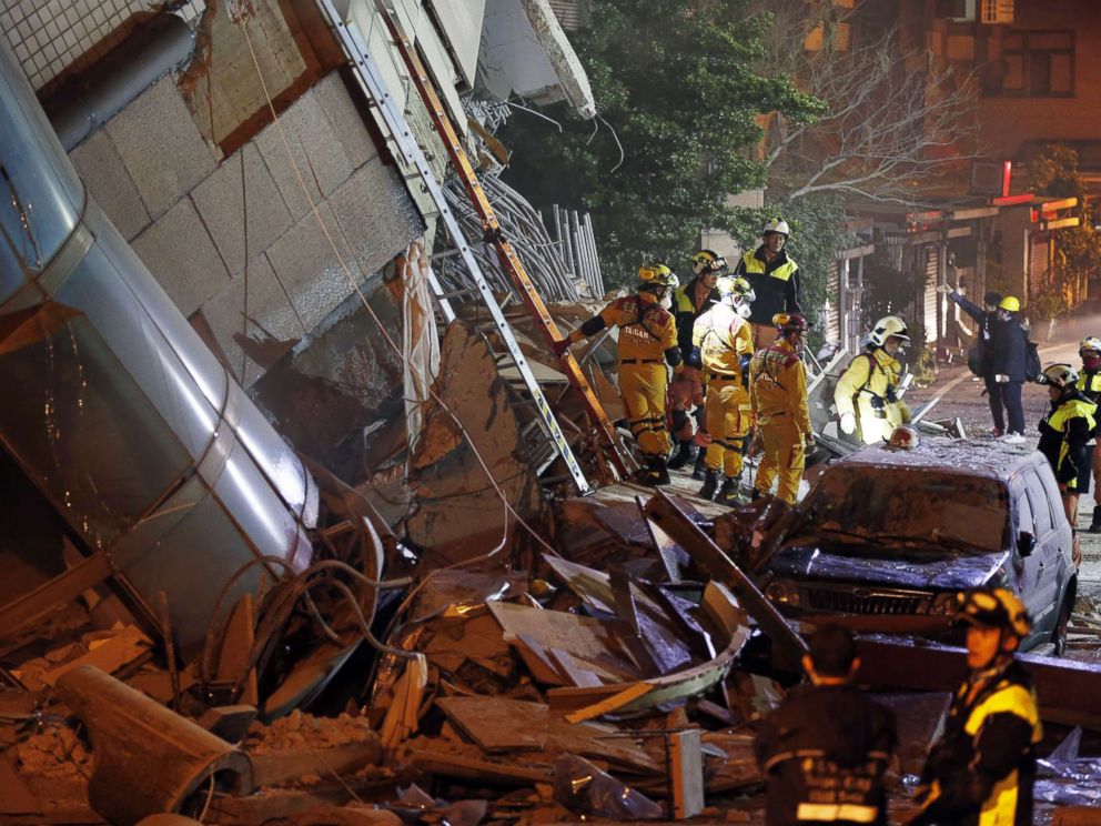 Rescuers scramble to find dozens of people trapped after earthquake ...