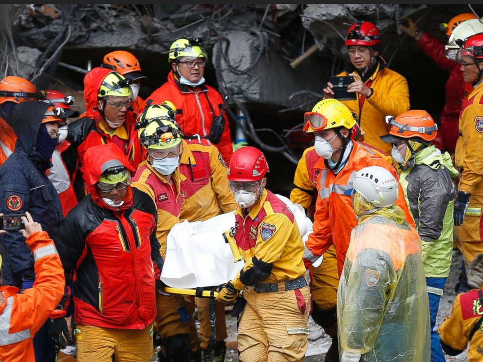 PHOTO:Rescue services recover a body from a damaged building in Hualien, eastern Taiwan,  Feb. 7, 2018. 