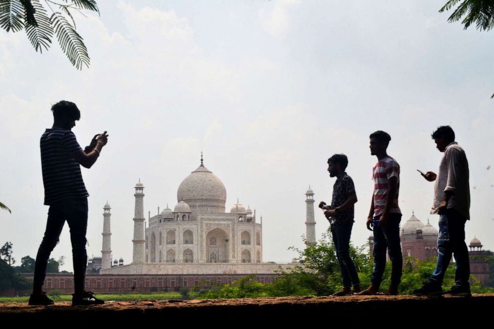 PHOTO: People take pictures with their mobile phones near the Taj Mahal in Agra, India, on Sept. 8, 2020.