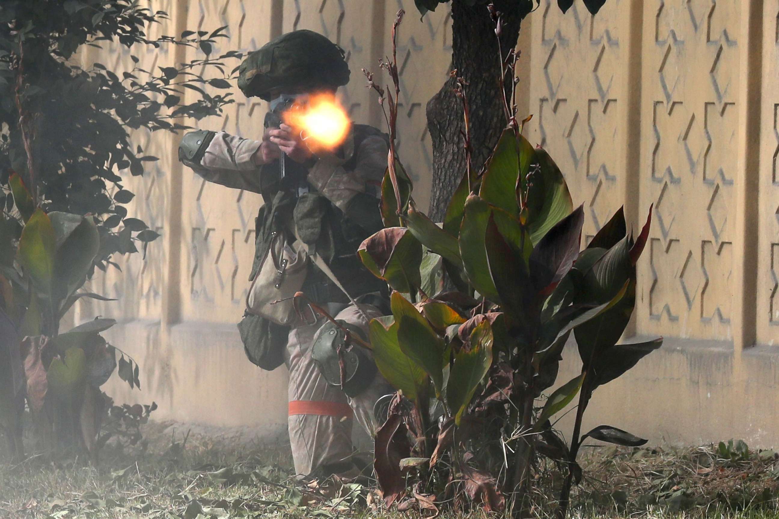 PHOTO: A serviceman practices countering an attack on a checkpoint during an exercise held by a counter-terror unit at the 201st Russian military base, Oct. 24, 2021.