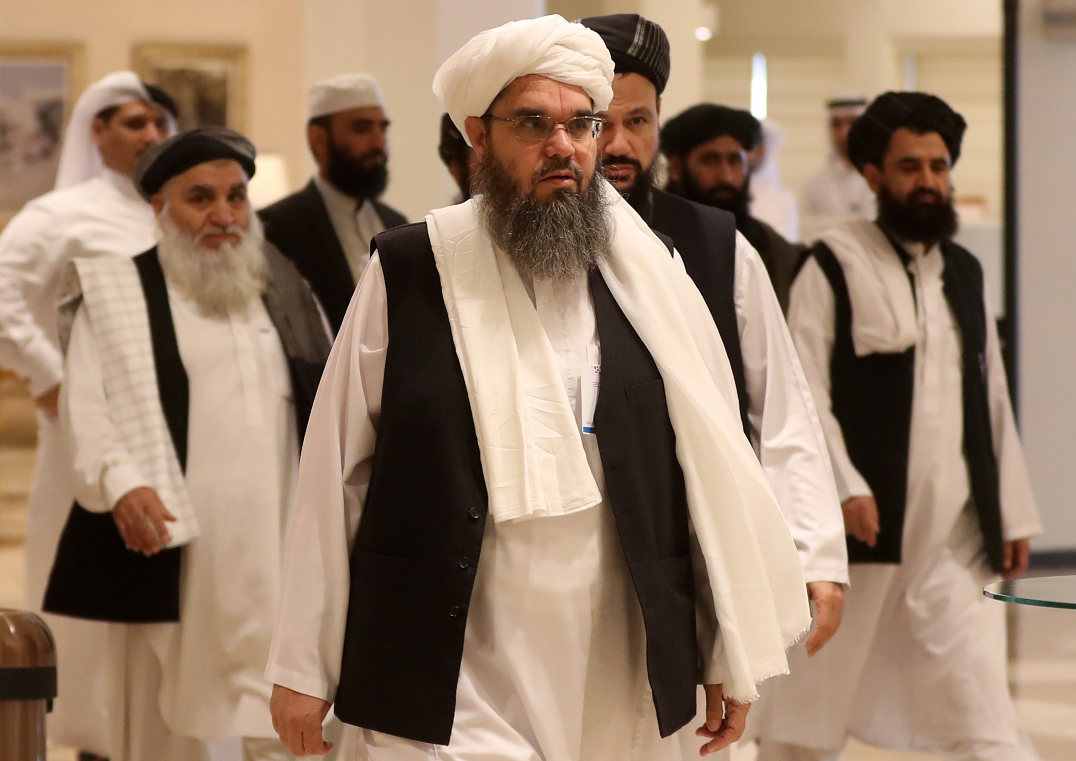 PHOTO: The Taliban's former envoy to Saudi Arabia Shahabuddin Delawar (C) arrives with other Taliban mebmers to attend the Intra Afghan Dialogue talks in the Qatari capital Doha on July 7, 2019.