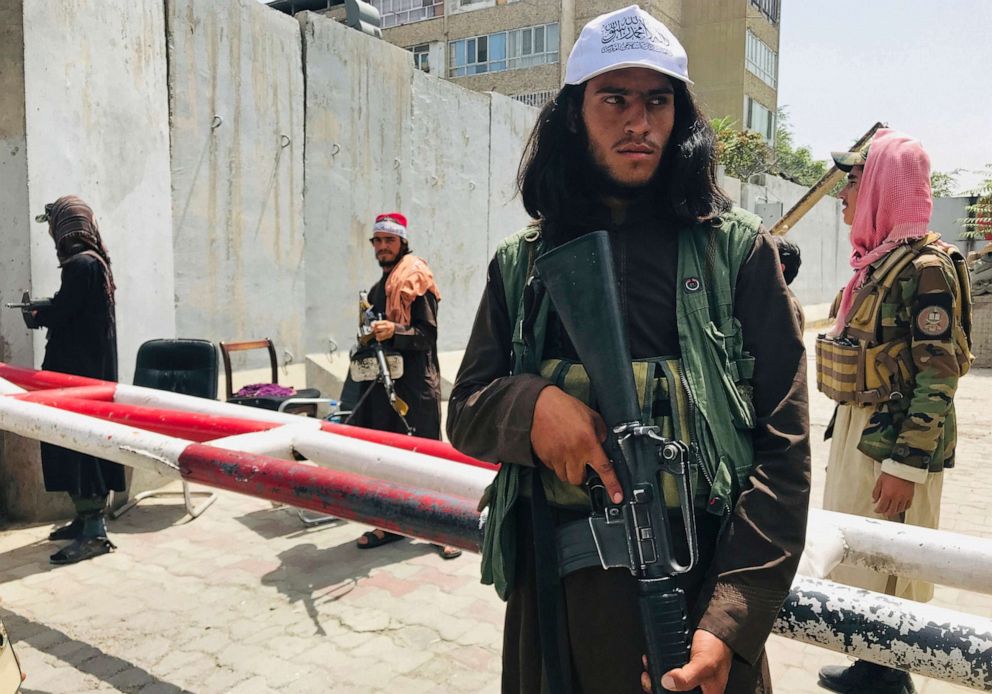 PHOTO: Taliban fighters stand guard at a checkpoint, previously manned by American troops, near the US embassy in Kabul, Tuesday, Aug. 17, 2021.