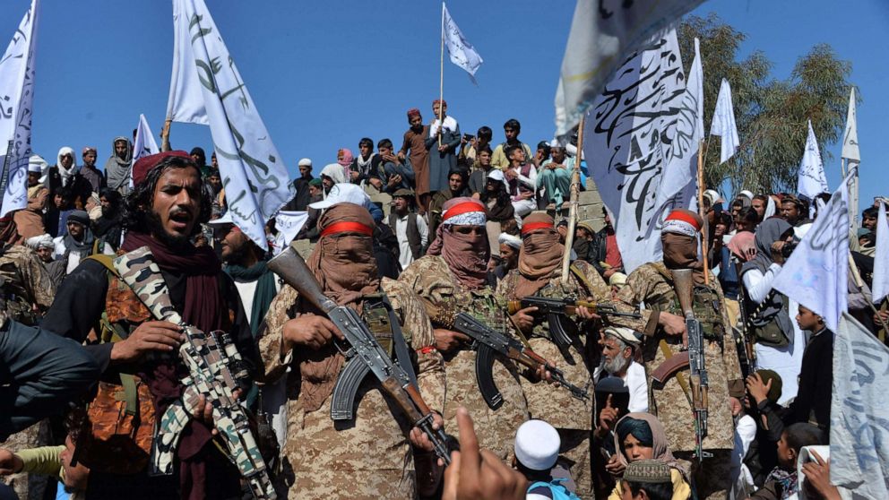 PHOTO: Afghan Taliban militants and villagers attend a gathering as they celebrate the peace deal and their victory in the Afghan conflict on US in Afghanistan, in Alingar district of Laghman Province on March 2, 2020. 