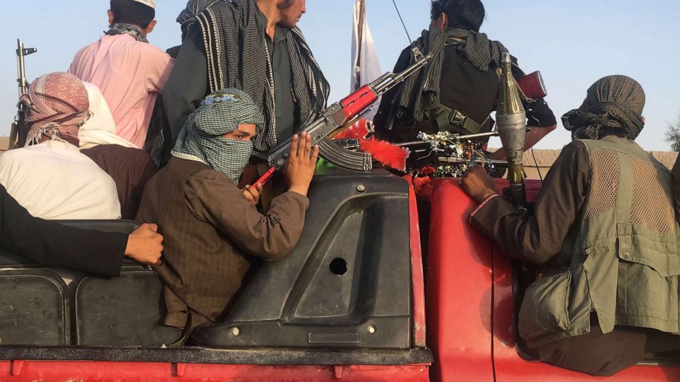 PHOTO: In this June 16, 2018 photo, Taliban fighters ride in their vehicle in Surkhroad district of Nangarhar province, east of Kabul, Afghanistan. Many Afghans view Saturday's expected U.S.-Taliban peace deal with a heavy dose of well-earned skepticism.