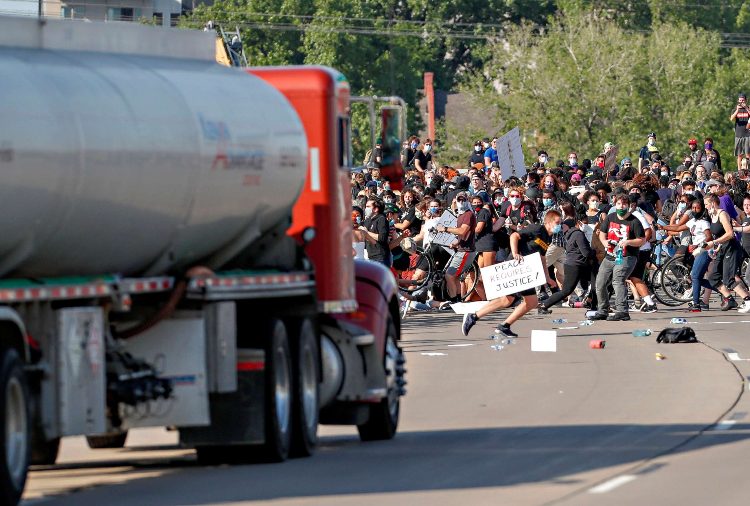 PHOTO: A tanker truck drives into thousands of protesters marching on 35W north bound highway during a protest against the death in Minneapolis police custody of George Floyd, in Minneapolis, May 31, 2020.