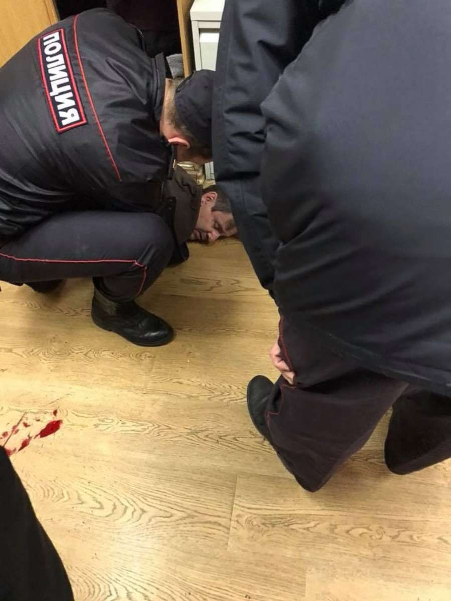 PHOTO: A handout photo shows Russian police officers detaining a man who attacked journalist Tatiana Felgengauer in the Echo Moskvy radio station office in Moscow, Oct. 23, 2017.