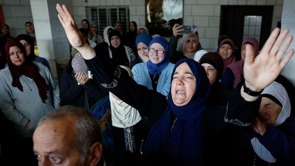 PHOTO: Mourners react during the funeral of American-Palestinian Tawfiq Ajjaq, 17, who, according to Palestinian officials, was killed by the Israeli security forces, near Ramallah in the Israeli-occupied West Bank, on Jan. 20, 2024. 