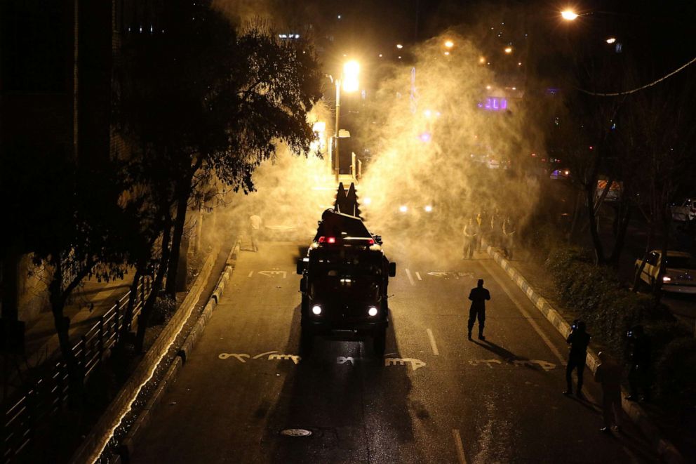 PHOTO: Iranian firefighters disinfect streets and allies in southern Tehran to halt the wild spread of the novel coronavirus on March 11, 2020.