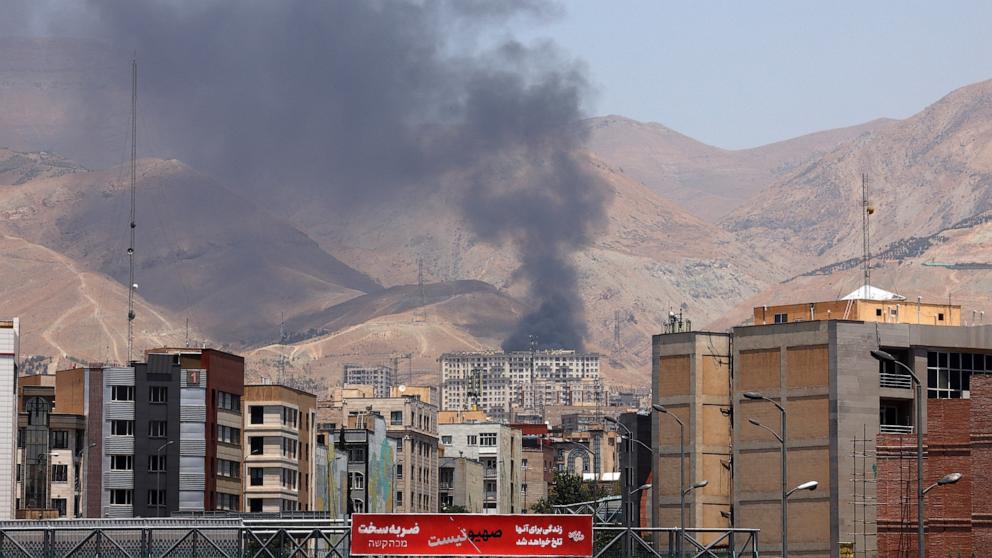 PHOTO: Smoke billows for the second day from the Shahran oil depot, northwest of Tehran, on June 16, 2025. 
