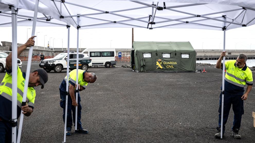 PHOTO: Workers set up tents at an expected reception point for passengers from the MV Hondius at the Granadilla Port on May 9, 2026, in Tenerife, part of the Canary Islands, Spain.