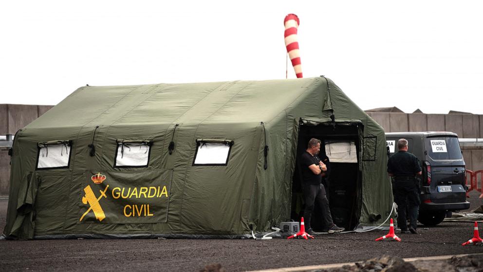 PHOTO: Members of the Spanish Civil Guard wait for the arrival of the Cruise MV Hondius at port of Granadilla de Abona on the island of Tenerife in Spain's Canary Islands on May 9, 2026.