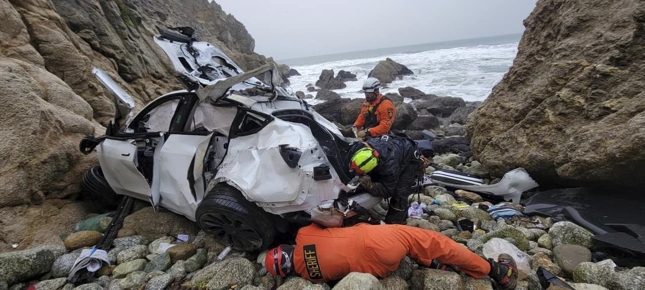 FILE PHOTO: In this photo provided by the San Mateo County Sheriff's Office, emergency personnel respond to a vehicle over the side of Highway 1 in Southern California's San Mateo County on Jan. 2, 2023.