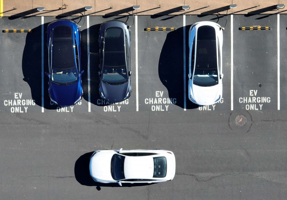 PHOTO: Tesla cars recharge at a Tesla charger station on Feb. 15, 2023 in Corte Madera, Calif. Tesla is partnering with the U.S. federal government to expand electric vehicle charging infrastructure in the U.S.