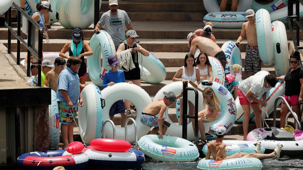 PHOTO: Tubers prepare to float the Comal River in New Braunfels, Texas despite the recent spike in COVID-19 cases in the state, June 25, 2020.