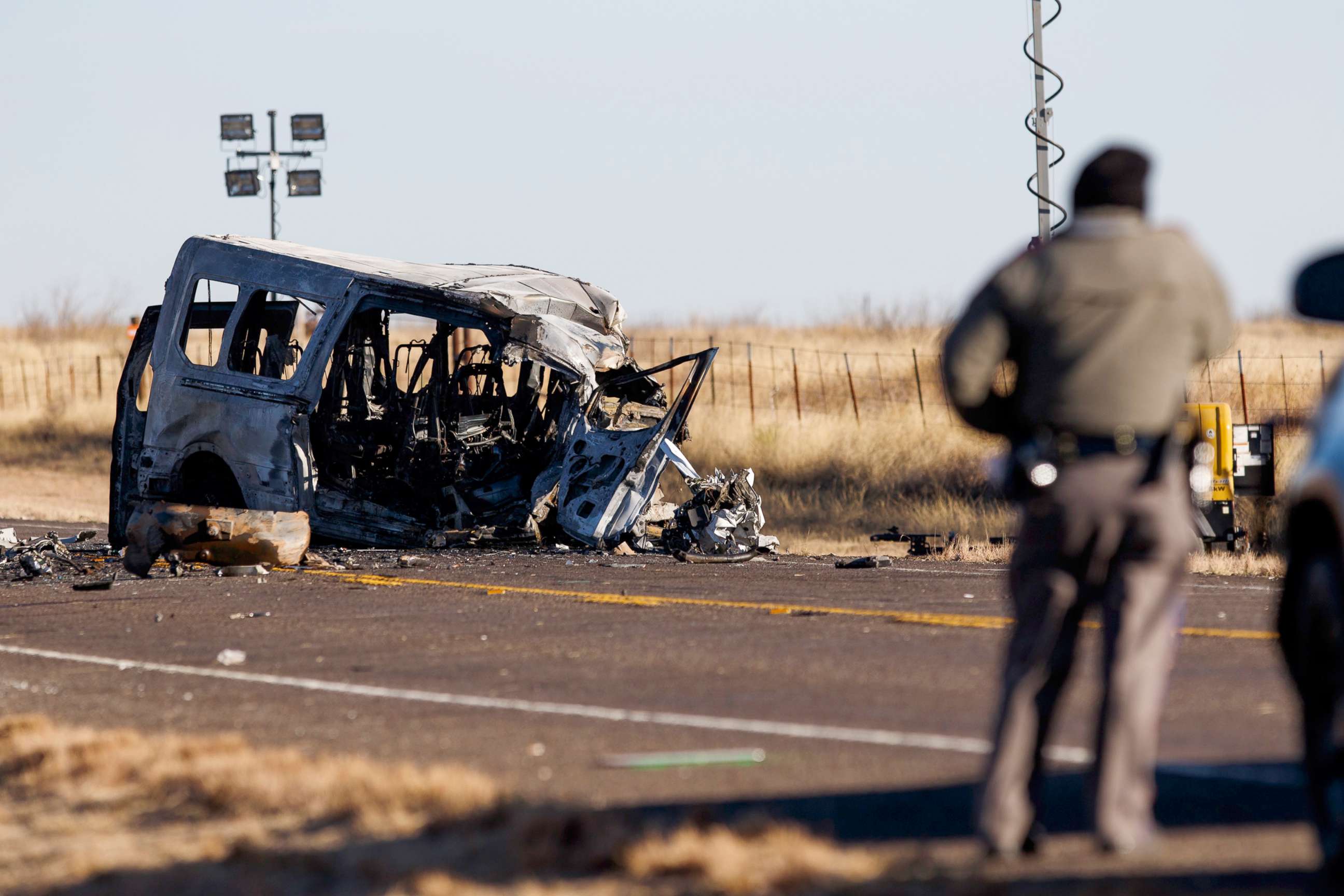 PHOTO: Texas Department of Public Safety Troopers look over the scene of a fatal wreck involving a van carrying members of the University of the Southwest men's and women's golf teams in Andrews County, Texas, March 16, 2022.