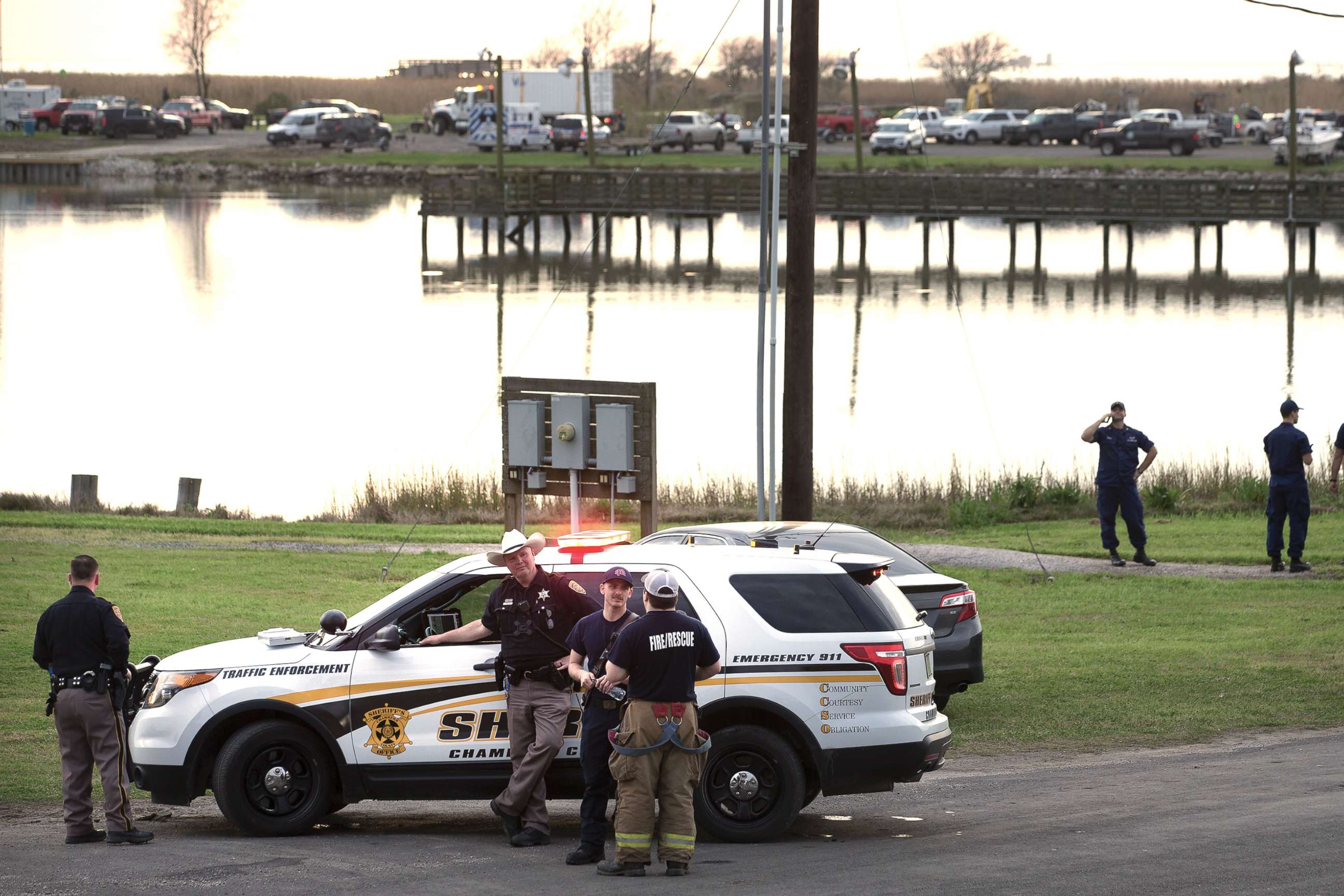 PHOTO: Law enforcement officers man a road block leading to a staging area during the investigation of a plane crash in Trinity Bay in Anahuac, Texas, Feb. 23, 2019. 