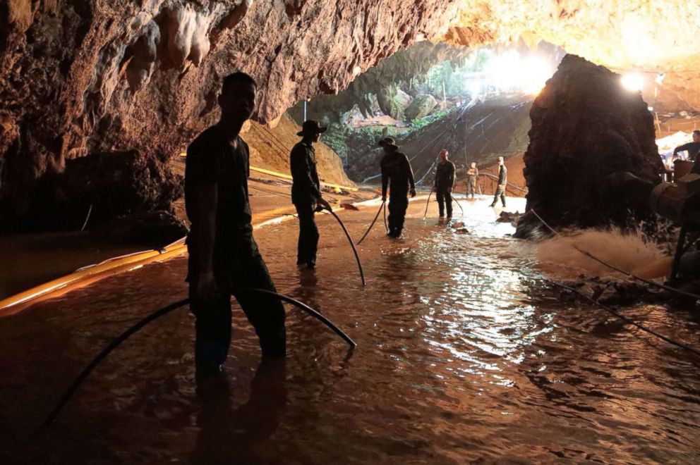 PHOTO: Thai Navy soldiers in the flooded Tham Luang cave during rescue operations for the 12 boys and their football team coach trapped in the cave at Khun Nam Nang Non Forest Park in the Mae Sai district of Chiang Rai province.