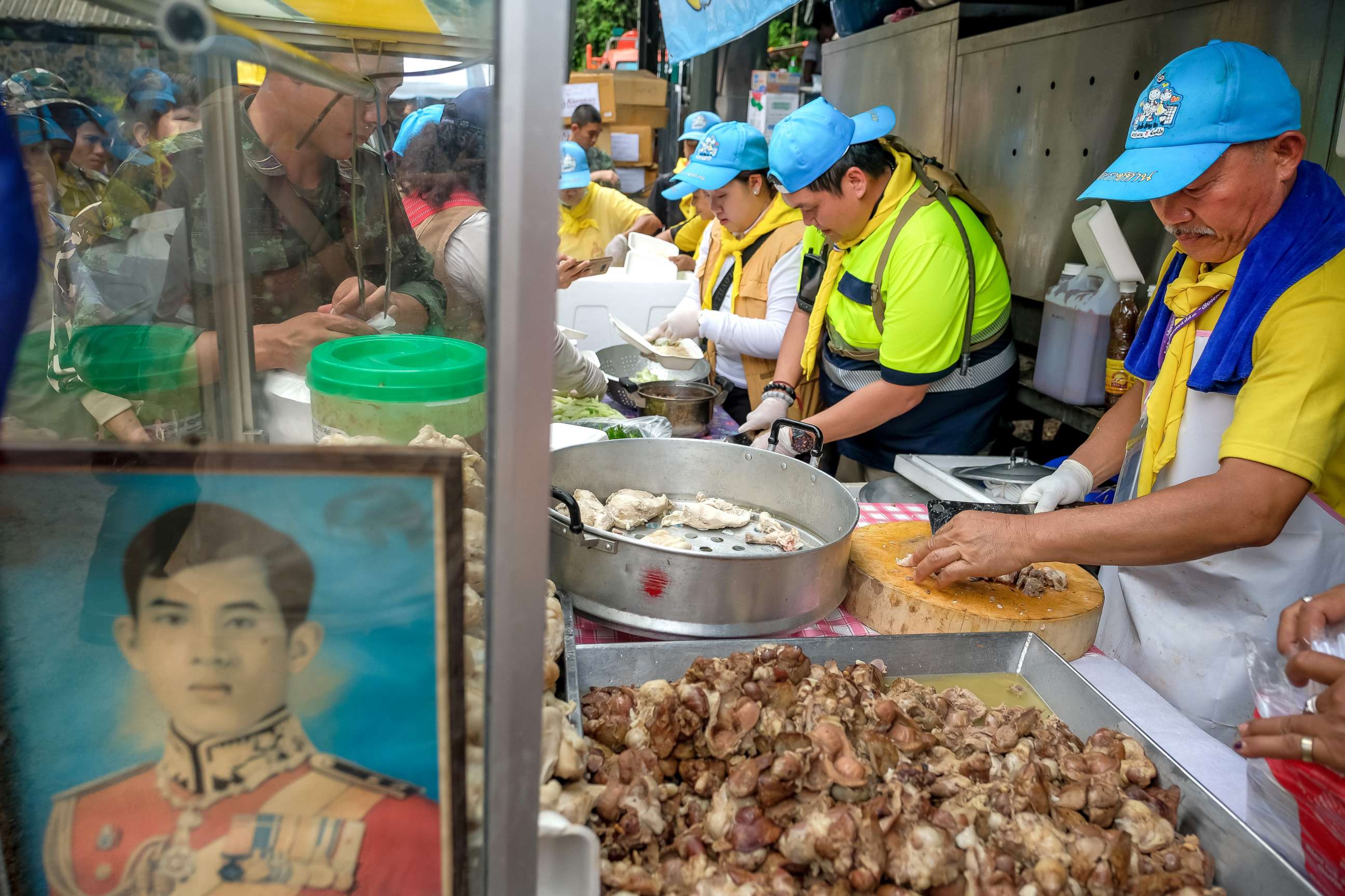 PHOTO: Volunteers prepare chicken rice for rescuers & family members at Khun Nam Nang Non Forest Park, July 05, 2018, in Chiang Rai, Thailand.