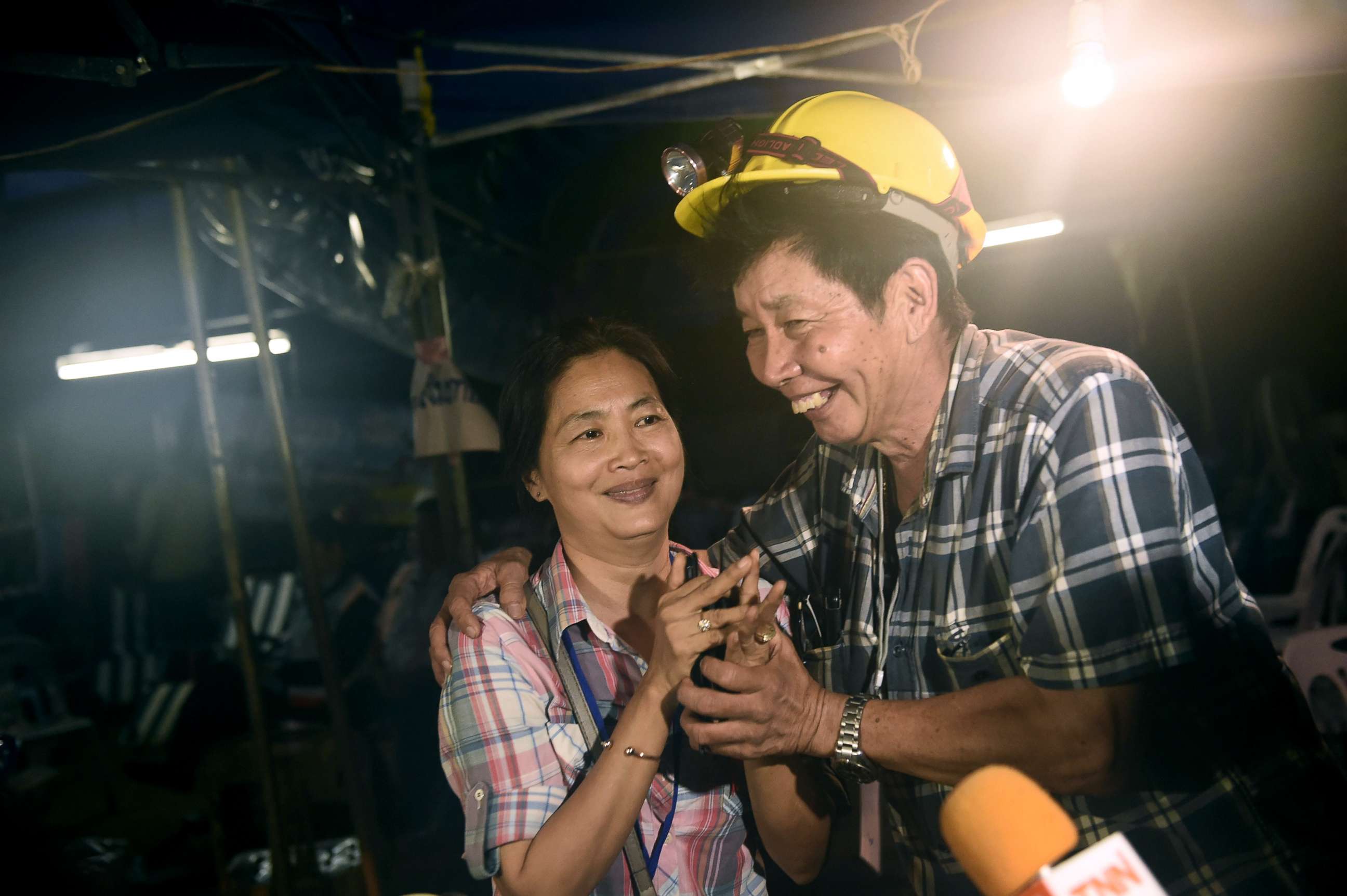 PHOTO: Family members celebrate while camping out near Than Luang cave following news all members of children's football team and their coach were alive in the cave at Khun Nam Nang Non Forest Park in the Mae Sai, Chiang Rai, Thailand, July 2, 2018.