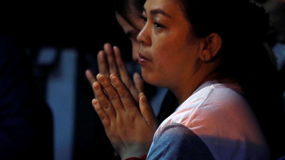 PHOTO: A family member prays near the Tham Luang cave complex, where 12 schoolboys and their soccer coach are trapped inside a flooded cave, in the northern province of Chiang Rai, Thailand, July 7, 2018.