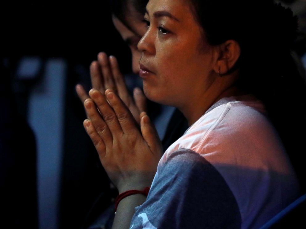 PHOTO: A family member prays near the Tham Luang cave complex, where 12 schoolboys and their soccer coach are trapped inside a flooded cave, in the northern province of Chiang Rai, Thailand, July 7, 2018.