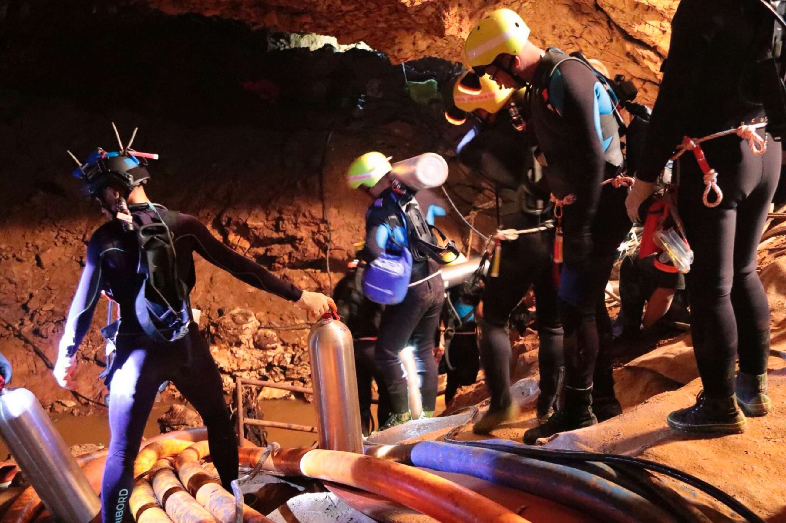 PHOTO: Thai rescue team members walk inside a cave where 12 boys and their soccer coach have been trapped since June 23, in Mae Sai, Chiang Rai province, northern Thailand in this undated photo released by Royal Thai Navy, July 7, 2018.