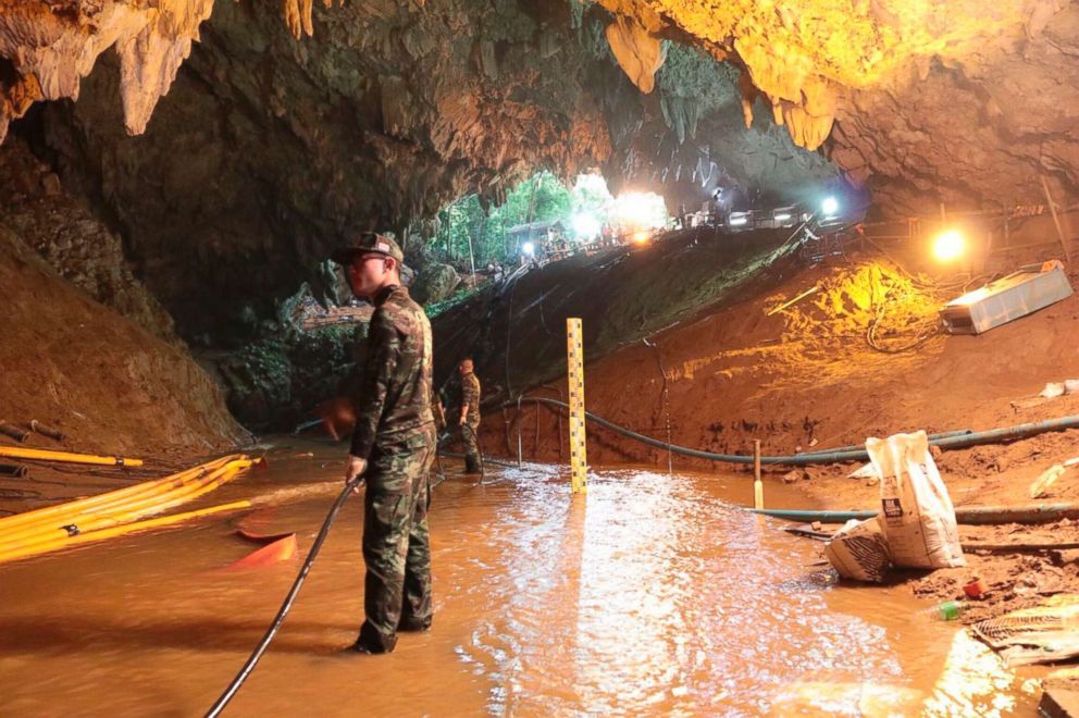 PHOTO: Thai rescue teams arrange a water pumping system at the entrance to a flooded cave complex where 12 boys and their soccer coach have been trapped since June 23, in Mae Sai, Chiang Rai province, northern Thailand in this undated photo.