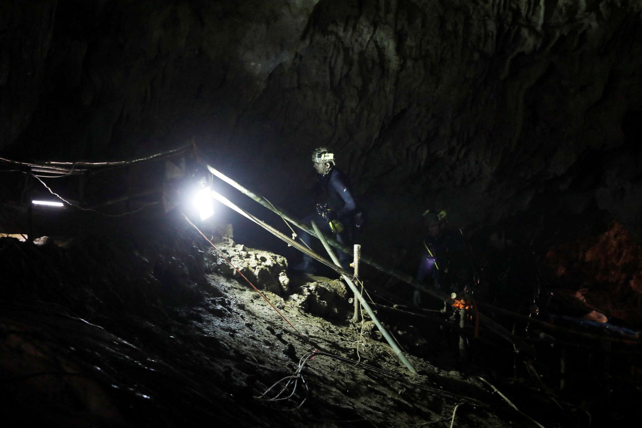 PHOTO: Divers walk inside Tham Luang cave complex, where 12 schoolboys and their soccer coach are trapped inside a flooded cave, in the northern province of Chiang Rai, Thailand, July 7, 2018.