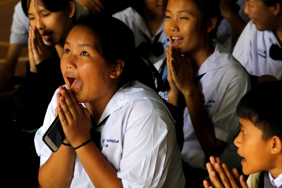 PHOTO: Classmates react after a teacher announces that some of the 12 schoolboys who were trapped inside a flooded cave, have been rescued, at Mae Sai Prasitsart school,  in the northern province of Chiang Rai, Thailand, July 9, 2018.