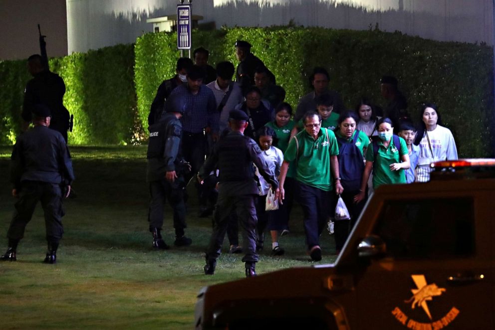 PHOTO: Thai security forces evacuate people on Feb. 9, 2020, as they chase a shooter after a mass shooting in front of the Terminal 21 shopping mall in Nakhon Ratchasima, Thailand on Feb. 8, 2020.