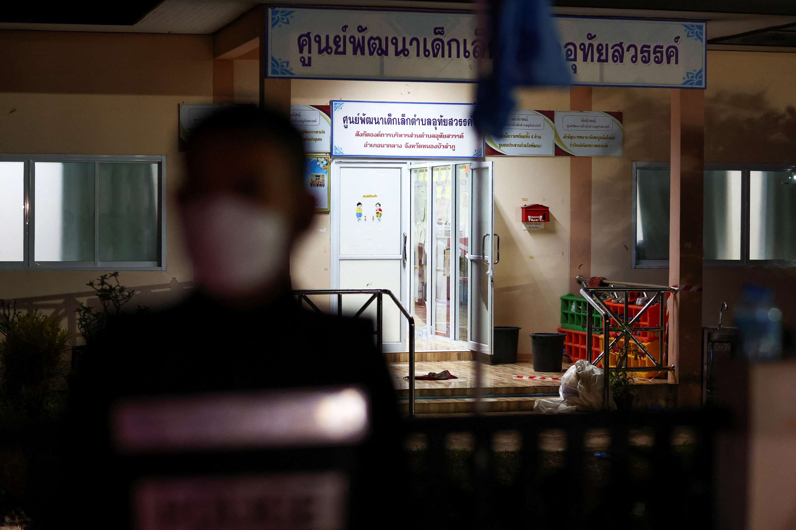 PHOTO: A police officer stands outside a day care center which was the scene of a mass shooting, in the town of Uthai Sawan, in the province of Nong Bua Lam Phu, Thailand, Oct. 6, 2022. 