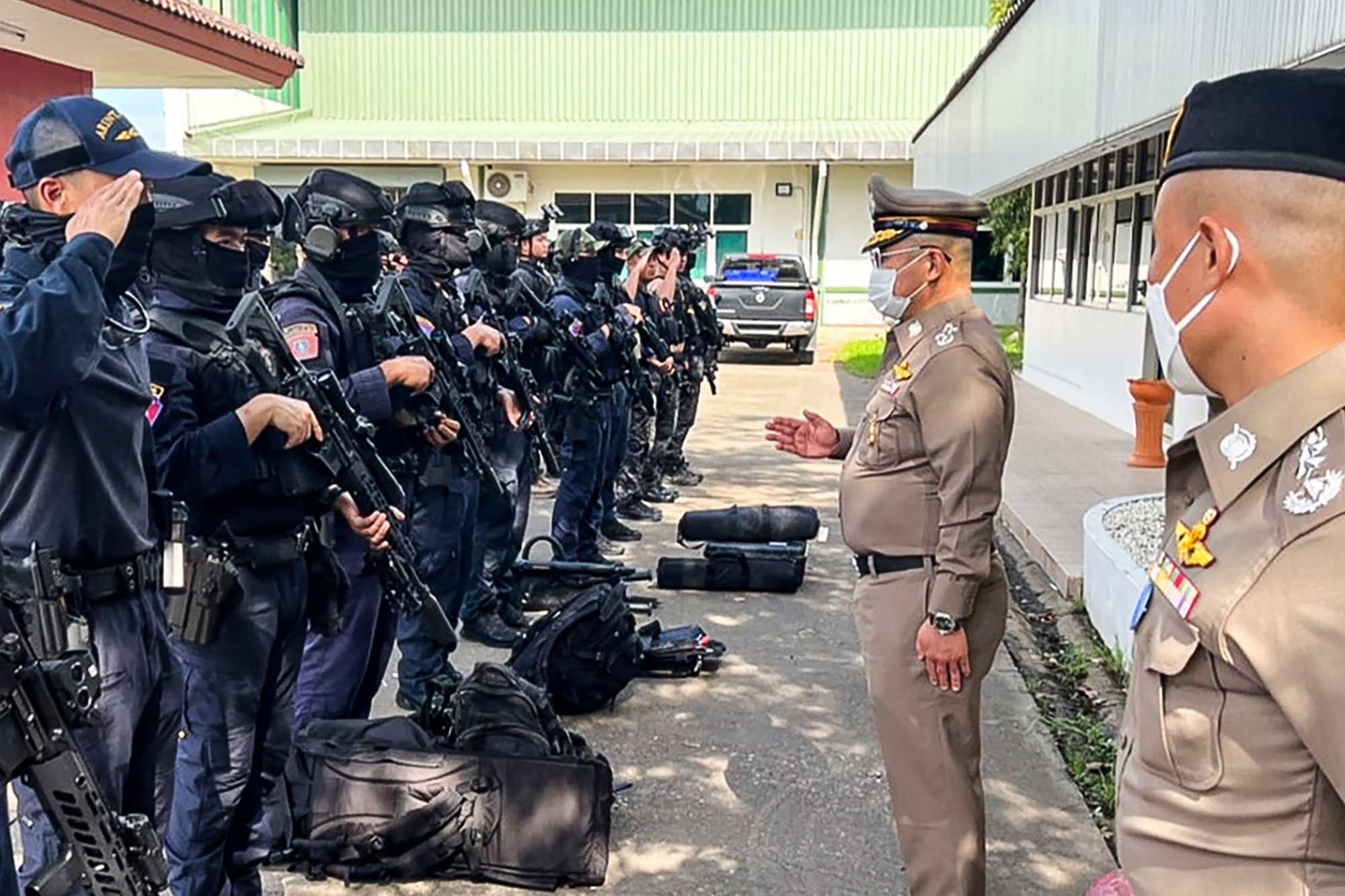 PHOTO: This handout picture taken and released by the Royal Thai Police on Oct. 6, 2022 shows National Police Chief Damrongsak Kittiprapat, second from right, speaking with a police operation team northern Thai province of Nong Bua Lam Phu.