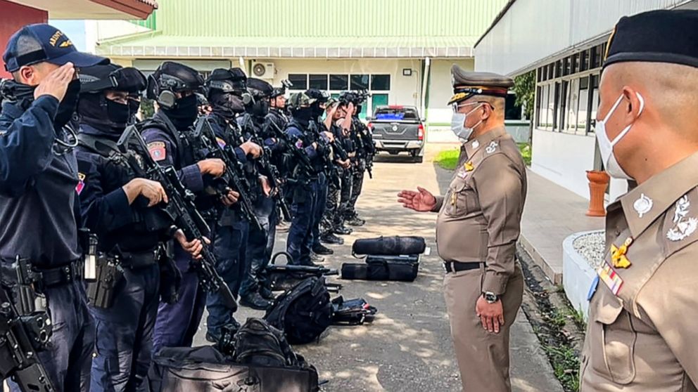 PHOTO: This handout picture taken and released by the Royal Thai Police on Oct. 6, 2022 shows National Police Chief Damrongsak Kittiprapat, second from right, speaking with a police operation team northern Thai province of Nong Bua Lam Phu.