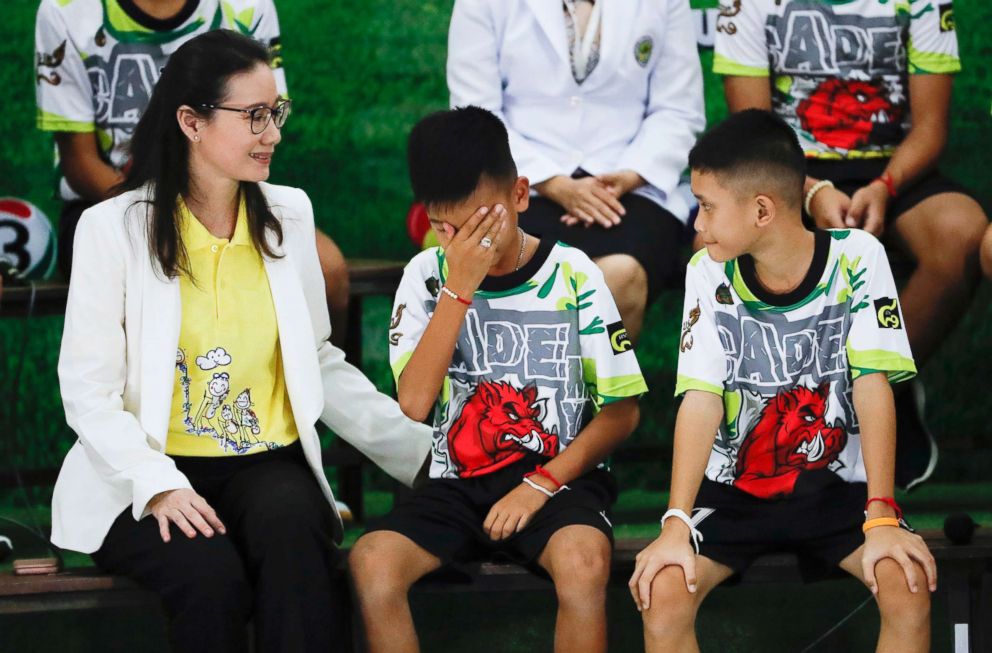 Rescued soccer player "Titan" Chanin Vibulrungruang reacts after paying respect to a portrait of Saman Gunan, the Thai Navy SEAL diver who died in the rescue attempt, during a press conference in Chiang Rai, Thailand, July 18, 2018.