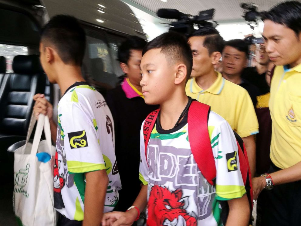 PHOTO: Two of the twelve rescued members of the Wild Boar soccer team depart from the Chiangrai Prachanukroh Hospital in Chiang Rai province, Thailand, July 18, 2018.