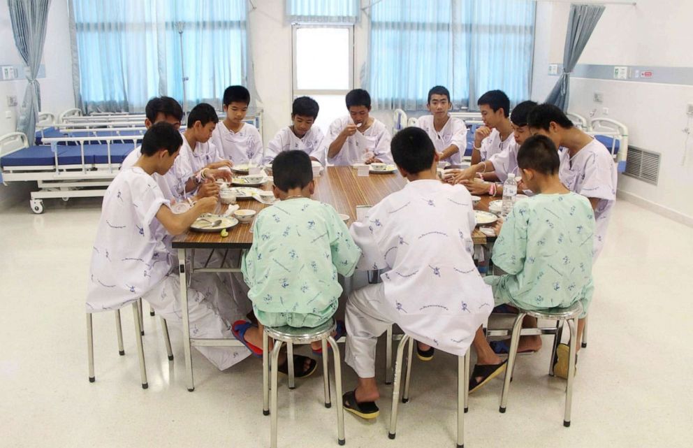 PHOTO: Some of the rescued soccer team members eat a meal together at a hospital in Chiang Rai, northern Thailand, July 15, 2018.