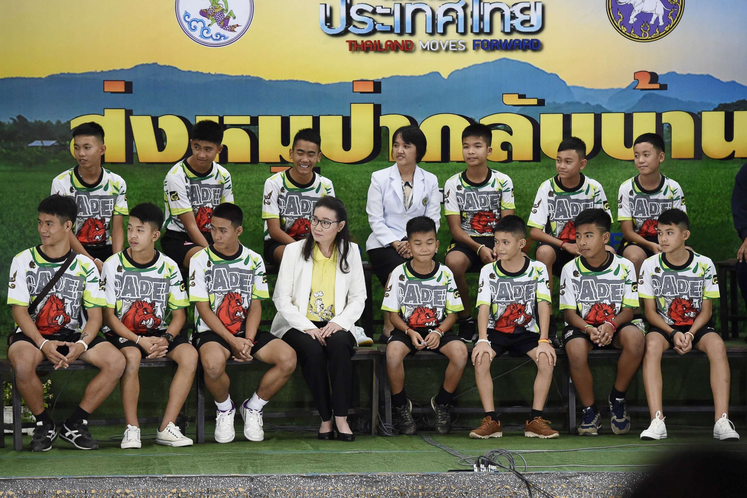 PHOTO: Twelve Thai boys and their football coach, rescued from a flooded cave after being trapped, attend a press conference in Chiang Rai, July 18, 2018, following their discharge from the hospital.