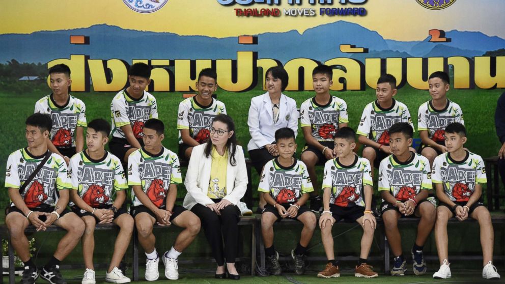 PHOTO: Twelve Thai boys and their football coach, rescued from a flooded cave after being trapped, attend a press conference in Chiang Rai, July 18, 2018, following their discharge from the hospital.