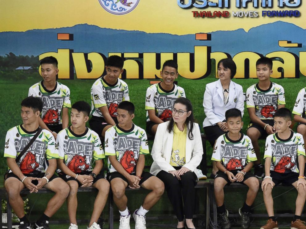 PHOTO: Twelve Thai boys and their football coach, rescued from a flooded cave after being trapped, attend a press conference in Chiang Rai, July 18, 2018, following their discharge from the hospital.