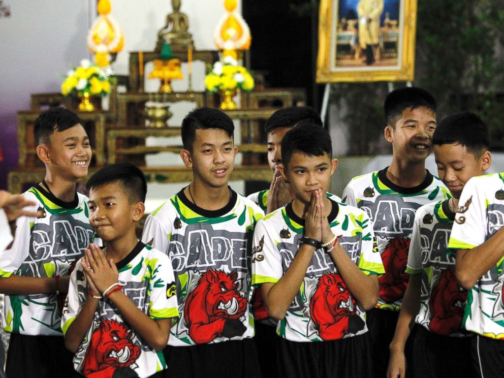 PHOTO: Some of the 12 members of the Wild Boar soccer team, who were rescued from the Tham Luang cave, greet the media at Chiang Rai Provincial Administrative Organization in Chiang Rai province, Thailand, July 18, 2018.