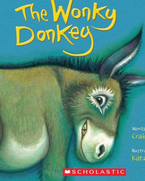 granny reading donkey story to baby