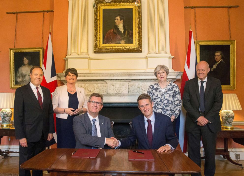 PHOTO: Pictured are Theresa May, Damian Green, Arlene Foster, Nigel Dodds, Jeffrey Donaldson 
and Gavin Williamson inside 10 Downing Street in central London, June 26, 2017. 